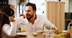 Taste, child or father with food at lunch for healthy meal, care or love for diet or wellness in family home. Giving, dad or girl kid eating for fun, nutrition or feast with snack, parent or support