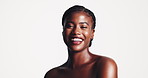 Skincare, laugh and face of black woman in studio with beauty, natural or facial routine. Happy, cosmetic and portrait of African female person with glow dermatology treatment by white background
