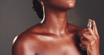 Perfume, spray and cosmetics with black woman for beauty, skincare and aesthetic on studio background. Neck, mist and model with body product, parfume and essence for luxury smell and fragrance