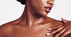 Shoulder, skincare and hands of black woman in studio for wellness, cosmetics and facial treatment. Dermatology, spa aesthetic and person with beauty for hygiene, salon and glow on white background