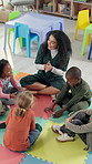 Sing, classroom and teacher with children on floor for music lesson, education and learning. School, happy students and kids with educator for creative activity, language development and knowledge