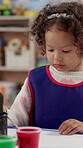 Girl, child and painting for art at school with paintbrush, creativity and picture with color. Education, learning and kid with activity for development with paint and paper for kindergarten artwork