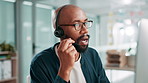 Computer, conversation and support with black man in call center for assistance or feedback. Contact us, customer service and headset with agency employee in workplace as online virtual assistant