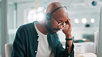 Call centre, tired and black man in office, headache or fatigue with stress, mental health or overwhelmed. African person, burnout or employee in workplace, exhausted or migraine with anxiety or pain