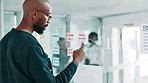 Business, glass wall and man in workplace, planning and brainstorming for profit growth. African person, financial advisor and employee with sticky notes, decision and calendar with ideas and choice