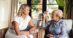 Talking, woman and senior mother at home for family visit with conversation, care and trust. Old person, daughter and love with support, bonding and relax with connection and happiness at house