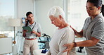 Elderly woman, checkup and physiotherapist with tablet, injury progress and medical report. Senior patient, helping and physiotherapy team with mobility assessment, rehabilitation and healing muscle