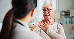 Doctor, senior woman and consultation with shoulder pain for medical checkup, symptoms or healthcare advice. Elderly patient, expert or health assessment for muscle ache or injury treatment at clinic