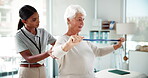 Senior woman, stretching and band with physiotherapist for injury, recovery and medical support. Elderly patient, helping and equipment for physiotherapy, mobility rehabilitation and muscle healing