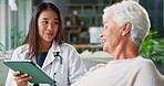 Tablet, checkup and doctor with senior woman in nursing home for medical consultation in living room. Conversation, digital technology and healthcare worker with elderly patient for treatment plan.