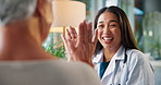 Healthcare, doctor and old woman in office, high five and support with recovery, healing or cure. Gesture, medical advice or senior person with professional, treatment or conversation with empathy