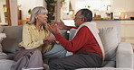 Argument, sofa and senior couple in home with conflict for infidelity, cheating or affair. Upset, fighting and elderly man in conversation with woman for marriage problem in living room together.
