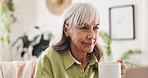 Home office, coffee and mature woman on laptop for article, journalism and editing story on internet. Tea, happy freelancer and computer for remote work with publication review, reading email or news