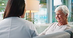Sofa, consultation and doctor with senior woman in retirement home for medical checkup in living room. Conversation, helping and healthcare worker with elderly patient for treatment plan in house.