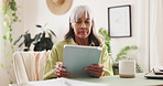Tablet, reading and mature woman relaxing in home for online bad news, update or notification. Digital technology, blog and female person checking website post for headline article in apartment.