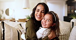 Sofa, mother and face of child for hug, bonding together and family relationship in living room at home. Couch, mom and happy girl in portrait for love, connection and affection on weekend in lounge