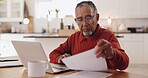 Reading, document and elderly man with laptop, retirement and review of insurance policy on website. Financial planning, typing and senior person with tech for pension fund, serious or budget in home