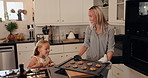 Baking, oven and mom with child with cookies for learning to make biscuits, dessert and pastry. Family, kitchen and mother with girl with homemade treats on tray for bonding, helping and excited