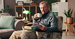 Coffee, senior man and book with reading for relax, knowledge and learning in retirement at home. House, male person and elder with novel for story, information and studying with tea drink at night