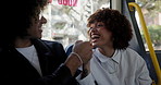 Talking, fist bump and friends on bus in city by window for morning commute, journey and trip together. Public transport, travel service and happy man and woman laughing, chat and in conversation