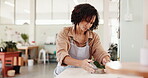Creative, pottery and shape with woman in boutique for crafting, manufacturing or production of ceramics. Clay, concentration and design with potter in gallery, studio or workshop for sculpting