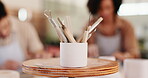 Pottery, art and cup of tools in workshop for artistic process, sculpture design and learning artwork. Closeup, people and equipment for craft production, handmade hobby and creative lesson in class