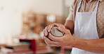 Clay, hands and pottery with person in workshop for creation or production of retail ceramics. Forming, molding and sculpting with artisan or potter in boutique studio for small business startup
