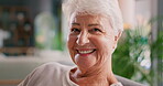 Calm, smile and face of old woman on sofa for retirement, nursing home and peace. Relax, elderly care and happiness with portrait of senior person in living room of house for wellness as pensioner