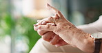 Senior, hands and ring with regret for marriage, memory or loss in grief or mistake at home. Closeup, elderly widow or person playing with jewelry for commitment choice, marital problems or issue