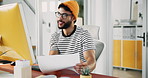Businessman, computer or paper at desk for creativity, article comparison or review in creative office. Journalist, smile or tech in agency for website update, topic research or document for planning