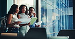 Business people, meeting and tablet with window in conference for corporate improvement or analysis. Group, employees or colleagues with technology or documents for company analytics or performance