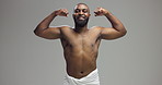 Studio, black man and face with flexing for kiss, arms muscle and confidence for fitness progress. Happiness, male person and bodybuilder with bicep in portrait, workout results and gray background