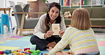 Learning, help and speech therapy for kid, education or giraffe card for language development. Child, woman and counseling session in psychology office for phonics, smile or teaching girl with autism