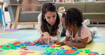 Building blocks, therapy and woman with kid on floor for playing, child development and progress. Psychology, pediatrics and therapist with toys for girl for consulting, session and talking in office