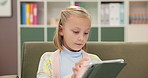 Girl, tablet and child on class sofa reading ebook with online learning, games or study. Relax, school and student kid on couch with digital app, education and story search on elearning website