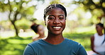 Fitness, nature and face of black woman in park for yoga class with calm, peace and zen exercise. Happy, relax and portrait of African female person with group outdoor in field for pilates workout.