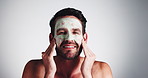 Man, skincare and apply mask on face for deep cleansing, morning routine or skin hydration treatment. Mockup, person or organic product for self care, exfoliation or acne control on studio background