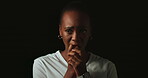 Scared, worry and face of black woman on dark background with fear, nervous and confused expression. Stress, anxiety and isolated female person with phobia, emotions and crisis reaction in studio