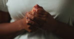 Scared, worry and hands of black woman on dark background with fear, nervous and confused expression. Stress, anxiety and isolated female person with phobia, emotions and crisis reaction in studio