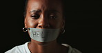 Face, help and black woman with tape in studio on dark background for gender equality or domestic violence. Portrait, silence or abuse and scared female victim with mouth covered for censored voice