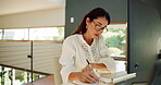 Mature, writer or woman in remote work with notebook for creative project, research or website. Home office, female author or freelancer with computer for campaign, writing ideas or publishing review