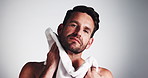 Skincare, man and cleaning face with towel for grooming routine, facial hair removal and fresh shave. Hygiene, person or beard self care on mockup for healthy skin or dermatology on studio background