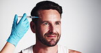 Hands, man and needle for injection of beauty, hair loss treatment and transplant procedure in studio. Thinking, person and mesotherapy medicine, scalp cosmetic and growth process on white background