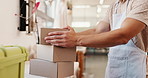 Business, package and man in studio, boxes or ecommerce with supply chain, fragile goods and delivery. Person, closeup or entrepreneur in shop, prepare order and art product with parcel or cardboard 