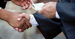 Handshake, people and money for bribe by court, corruption or fixed guilty verdict with payment for illegal deal. Scam, fraud and crime with lawyer outdoor for unethical cash or government cover up 