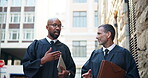 Teamwork, advice and judge or people in city for courtroom discussion, legal planning and justice constitution. Trial collaboration, verdict claims and evidence legislation with men for law case
