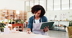 Woman, writing and tablet in workshop for pottery, inventory management and clay order. Small business, documents or creative entrepreneur in startup for ceramics, craft checklist or stock supply