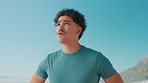 Thinking, tired and man with blue sky for fitness travel, planning and ideas for workout break. Space, male person and thoughts with running reflection, sports recovery and nature scenery of wellness