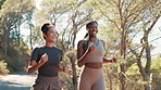 Women, running and friends at park, training and path in nature, fitness and workout for wellness in summer. People, partnership and girl with exercise for marathon, happy and challenge with cardio