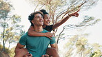 Couple, pointing and piggyback for fitness in nature for exercise, fun training and playful break. Smile, people and embrace of support, romance and bonding together for sightseeing of travel workout